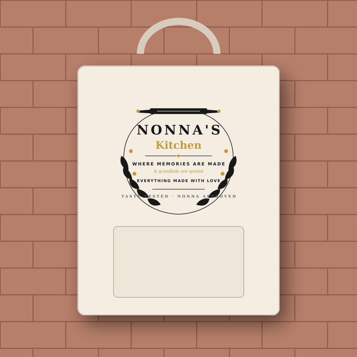 Rustic Italian farmhouse oat linen chef apron with Nonnas Kitchen heat-transfer vinyl on terracotta brick wall