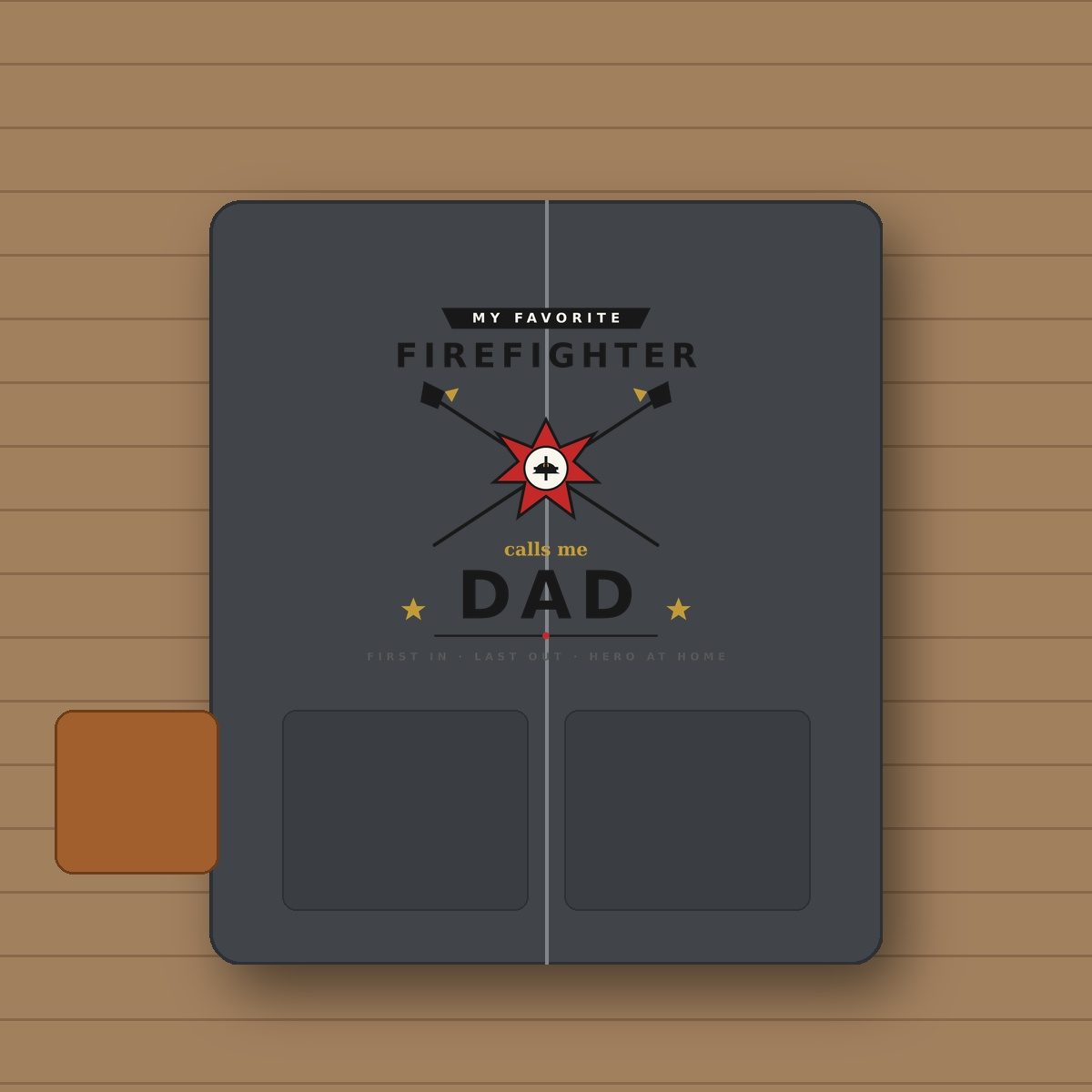 Firefighter Dad SVG heat transfer vinyl on dark heather gray zip-up hoodie on workshop oak table with leather firefighter rescue gloves