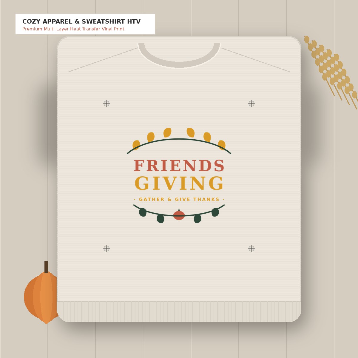 Friendsgiving SVG autumn lettering in Terracotta Rust and Warm Mustard printed on heather oatmeal fleece sweatshirt flatlay on rustic oak table with pumpkins